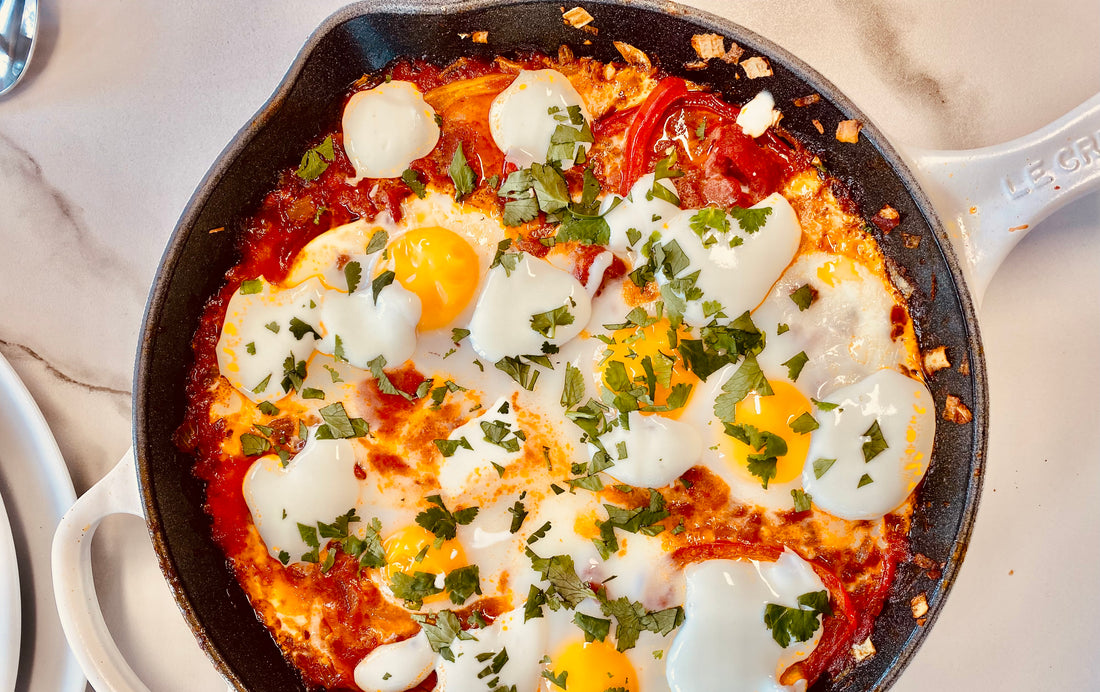 Shakshuka in white cast iron pan