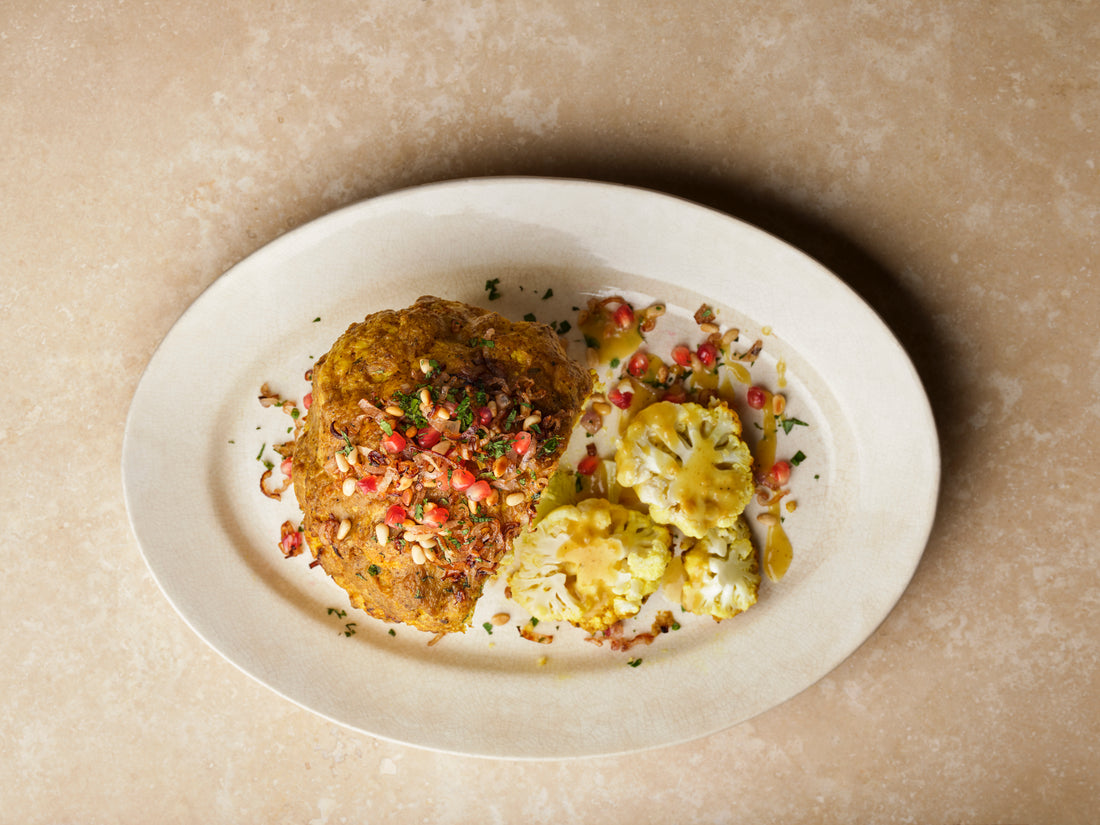 Whole head of cauliflower on a plate